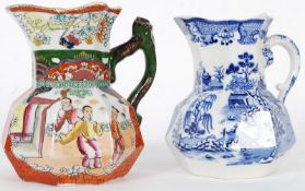Two Masons patent Ironstone Hydra jugs, one blue and white and one of bright colouring. 16cm tall.