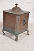 An early 19th century handbeaten copper coal box of square form having cabriole legs with inner