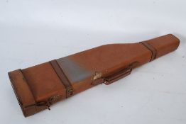 A vintage leather ` Leg Of Mutton ` gun / shotgun case with cap to end.