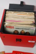 A record  box of singles, all from the 70's to include Pink Floyd, gerry rafferty, Gary Moore,