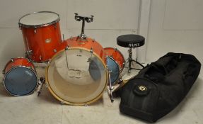 A set of Mapex drums, including bass drum, hi-hat drums, cymbals. Finished in a mottled orange