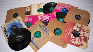 A collection of 78's to include Sam Cooke, The Olympics, The Crickets, and others. 14 in total.