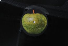 BEATLES: A Beatles ' White Album, ' being incorrectly printed with the inside cover being upside