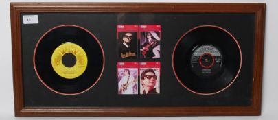 MEMORABILIA: A framed and glazed Roy Orbison presentation display, with Chinese phone cards