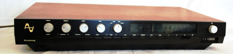 An Armstrong series 600 FM Tuner Section finished with teak surround with original box and packaging