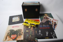 A collection of vinyl record LP albums to include The Clash, the Who etc. 50+ various conditions