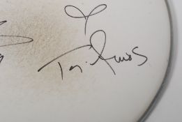 AUTOGRAPHS: A Remo Drum skin signed by Tori Amos and band in black marker to front, and dated 2009.