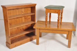 A Victorian style pine open window bookcase together with a pine dressing table / piano stool and