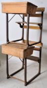 A pair of Industrial school desks in beech wood and sat on wrought iron supports