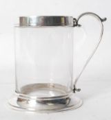 A hallmarked Sheffield silver rimmed and handled glass tankard, with hallmarks to top and bottom.