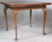 A 1940's oak drawleaf table on cabriole legs.