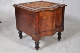 A Victorian mahogany commode. Raised on turned legs with hinged top and pull out stand. Finished