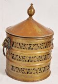 A brass coal skuttle with pierced fret work and cast iron kettle