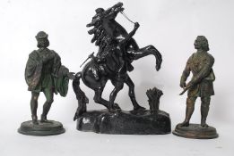 A 20th century cast metal study of a rearing horse, along with two other cast metal figures, one