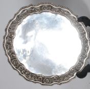 A silver card tray  with gadrooned fluted edge and foliate decoration. Weighs approx 6.5oz. measures