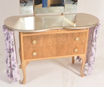 A 1940's ladies walnut dressing table chest having kidney shaped top with glass cover, dressing