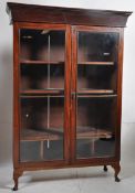 A 19th century mahogany bookcase display cabinet. Raised on later cabriole legs supporting a