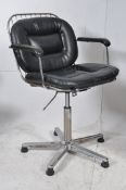 A Harry Bertoia style american wire work office swivel desk chair. Chrome base having original vinyl