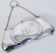 A Chester hallmarked large silver ladies evening purse of shaped form opening to compartmental