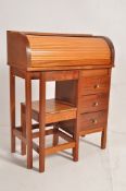 A Tambour fronted childs desk by Pegasus with three drawers and matching chair. H88cm x W36cm x