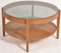 A 1970's retro smoke glass and teak wood circular coffee table  in the Danish style having squared