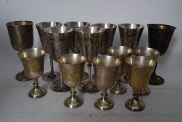 A collection of silver plated wine goblets having chased decoration to the bowls. 14 in total (