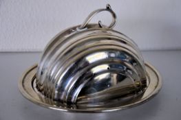 A 1930's Art Deco silver plate tureen. the angular arched lid over oval plate. Stamped EPNS to