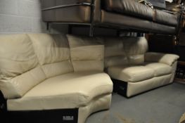 A large contemporary corner sofa / suite in cream leather. The sofa comprising two x 2 seater