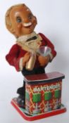 A vintage tin plate  toy bar tender Charlie Weaver being battery operated