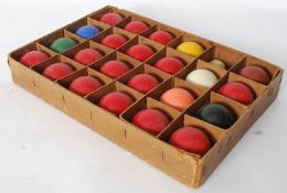 A set of vintage snooker balls complete in the original sectioned box