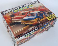 A Scalextric Mighty Metro racing car set with cars, controllers and track etc