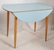 A 1950's retro blue formica drop leaf dining table. Raised on angular beech wood legs with blue