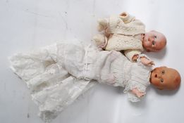A vintage composition Pedigree childs doll with painted features and marks to back, along with a