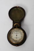 A brass cased pocket barometer by TA Reynolds & Co, of London in original leather box.