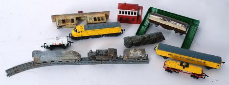 A large collection of vintage diecast Lesney trains, tracks and other railway items to include