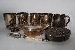 A collection of silver plate items to include half tankards, an Asprey of London small tureen with