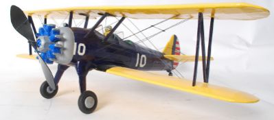 A hand built model of a WWII bi-plane, with scale propellar and moving wheels. 55cm long and 71cm
