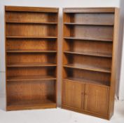 A good pair of oak veneer large library tall bookcase cabinets having adjustable shelves. One with