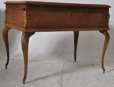 A 1930's Art Deco mahogany bijouterie display cabinet table. Raised on cabriole legs with ormulu