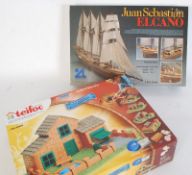 A Juan Sebastian Elcano Wooden boat model kit together with a Teifoc 580pc model house kit