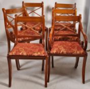 A set of 6 Georgian / Regency yew wood effect dining chairs. Raised on sabre supports having drop in