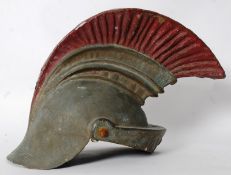 A reproduction Roman Centurian helmet, being constructed in fibreglass with faux fan to top.