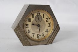 A vintage Canadian Westclox Art Deco 1930's travel alarm clock in angular metal case with decorative