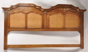 A large contemporary oversized hardwood and bergere caned headboard having inlaid detailing to