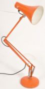 A good Herbert Terry, England. Circa 1960's retro orange anglepoise lamp in orange. Stamped to the