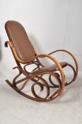 A Thonet style bentwood and leather rocking chair