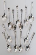 A set of 6 hallmarked silver spoons being rococo inspired to the stems with plain bowls, a set of