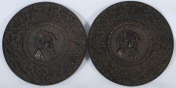 A pair of Portugese bronze wall plaques.