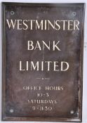 A brass wall sign for Westminster Bank, by H. Adicot & Son, Weston Super Mare. H62cm  W