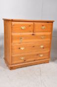 A Victorian style pine cottage chest of drawers having short drawers over deep drawers with brass